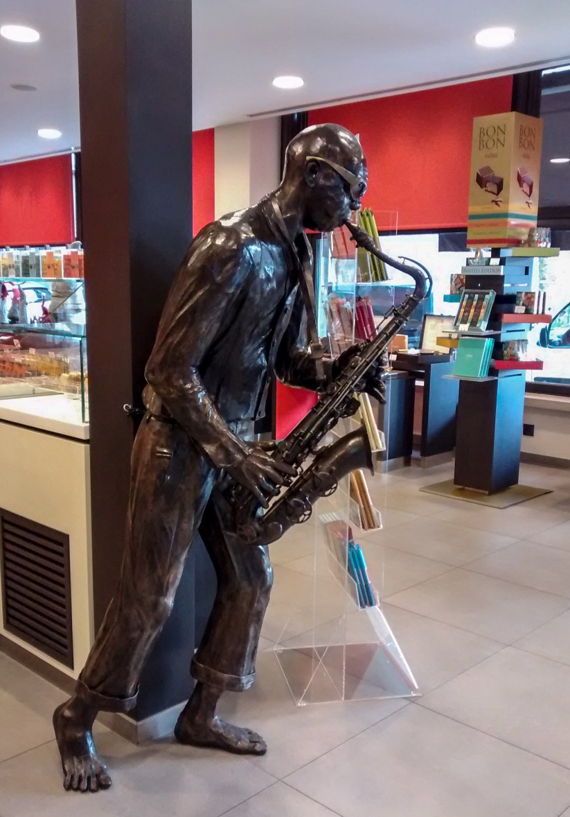 Dinant Belgium - Sax Player in chocolate shop