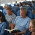 Crying baby on plane, 12 clever hacks to make flying economy comfortable, TravelBloggers.ca, Iain Shankland